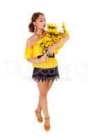 Beautiful woman standing with sunflowers.
