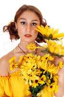 Beautiful woman with a bunch sunflowers.