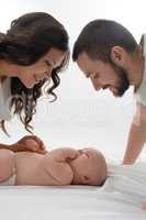 Happy young family with newborn baby