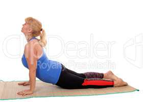 Yoga trainer showing stretching.