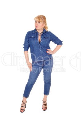 Woman in jeans clothing standing.