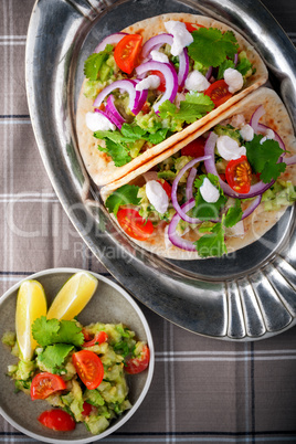 Chicken Tacos with vegetables served on the table