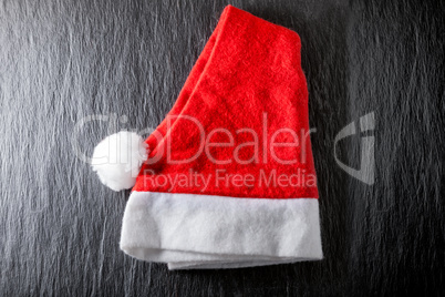 Red and white Santa's Hat on black background