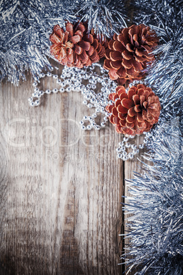 Home decor pine cones on a wooden background