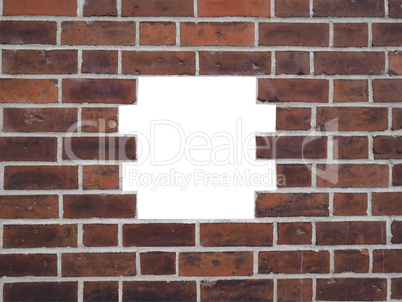 Red brick wall with hole