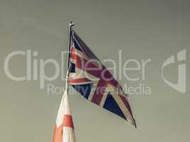 Vintage looking Flag of UK over blue sky