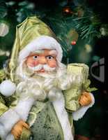 Big Santa Claus with gifts in hand, vintage toning