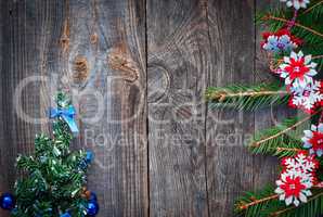Christmas background with fir branches  on a gray wooden backgro