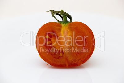 Half tomato isolated on white