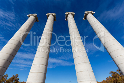 Four massive columns, blue sky in Barcelona of Spain