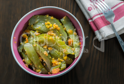 Marinated cucumbers with carrots and spices.