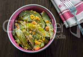 Marinated cucumbers with carrots and spices.