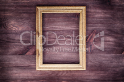 Empty wooden frame on a wood textured surface