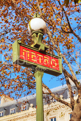 A pole with metro sign