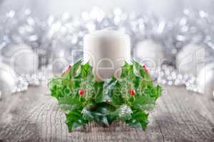 Christmas Decorations including candle on a wooden surface