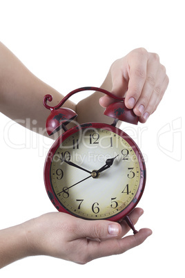 Female hand with alarm clock