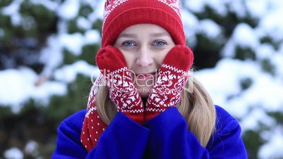 Attractive woman freezing outdoors in winter