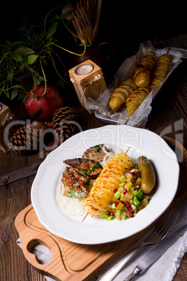 fried liver with fried potato and salt cucumbers