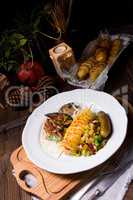 fried liver with fried potato and salt cucumbers