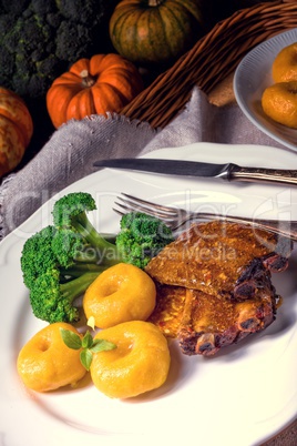 dumplings with pumpkin puree and grilled ribs