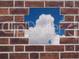 Red brick wall with hole