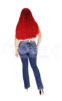 Woman with long red hair from back.