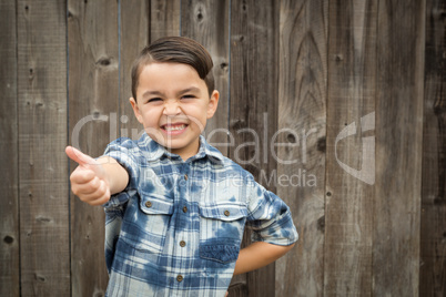 Young Mixed Race Boy Making Hand Gestures
