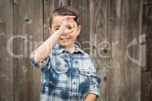 Young Mixed Race Boy Making Hand Gestures