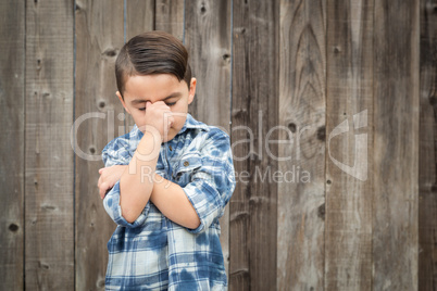 Frustrated Mixed Race Boy With Hand on Face