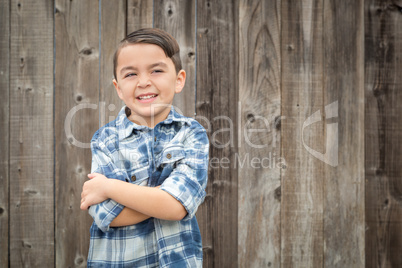 Young Mixed Race Boy Portrait Against Fence