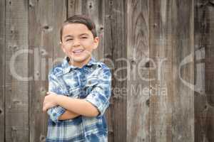 Young Mixed Race Boy Portrait Against Fence