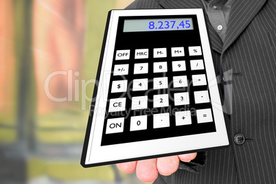 Man holds pocket calculator