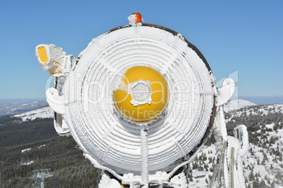 Frozen snow cannon, close up from behind