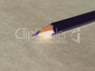 Violet pencil over paper