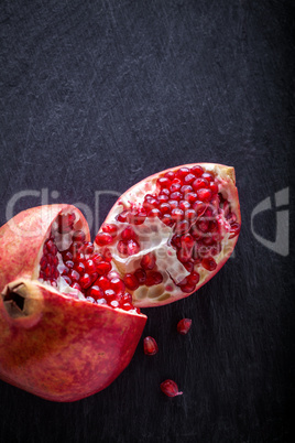 Pomegranate on a stone plate