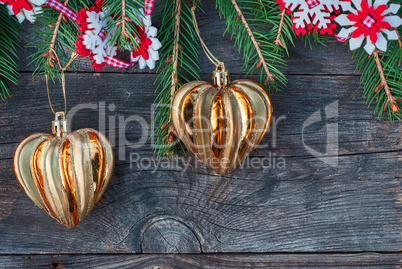 Christmas background with a branch of spruce and toys