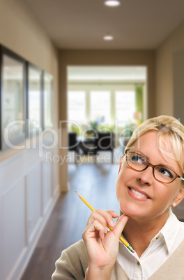 Woman with Pencil Inside Hallway of House