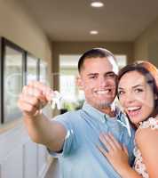 Military Couple with House Keys Inside Hallway