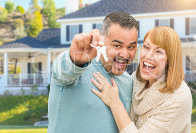 Happy Mixed Race Couple in Front of House with New Keys