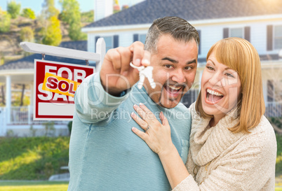 Mixed Race Couple With Keys in Front of Real Estate Sign and New