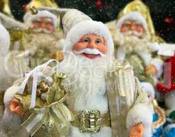 group of Santa Clauses with gifts