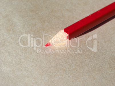 Red pencil over paper