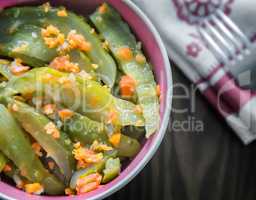Marinated cucumbers with carrots and spices.