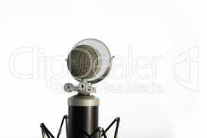 Vocal condenser microphone with wind screen isolated on white ba
