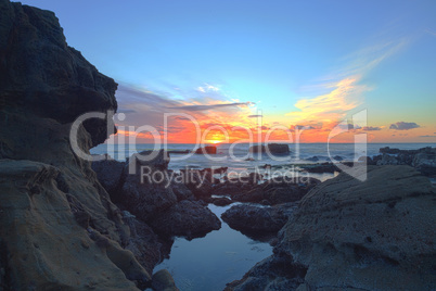 Long exposure of sunset over rocks