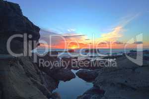 Long exposure of sunset over rocks