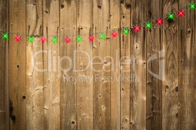 Lustrous Wooden Background with Green and Red Christmas Lights