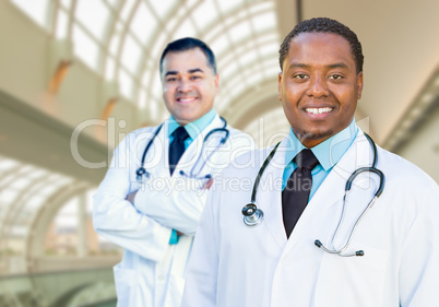 African American and Caucasian Male Doctors Inside Hospital