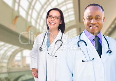 Female and Male Caucasian and African American Doctors in Hospit