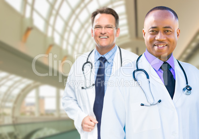 African American and Caucasian Male Doctors Inside Hospital
